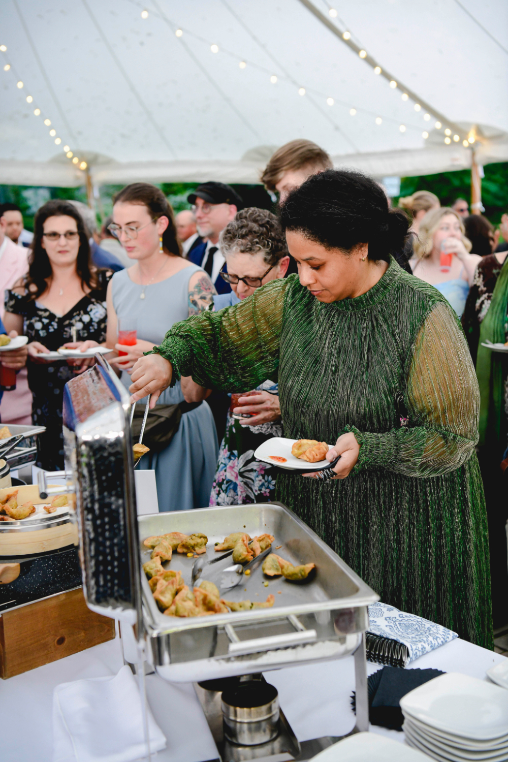 Guests line up to sample hors d’oeuvres at a Buttermilk Falls Inn wedding.