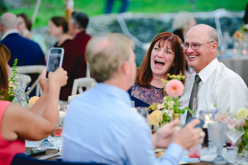 Friends taking pictures of each other during the reception.
