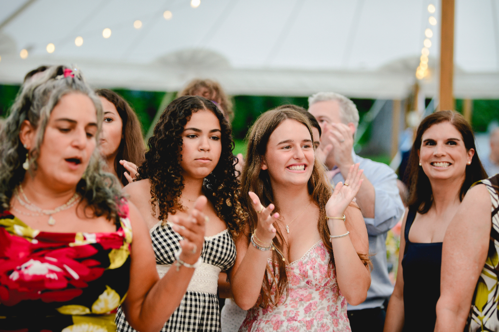 guests at Milton ny wedding clapping and having fun