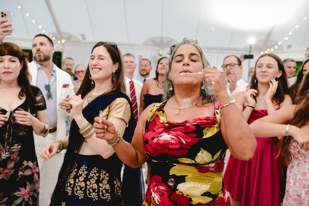 guests blowing bubbles on the dance floor