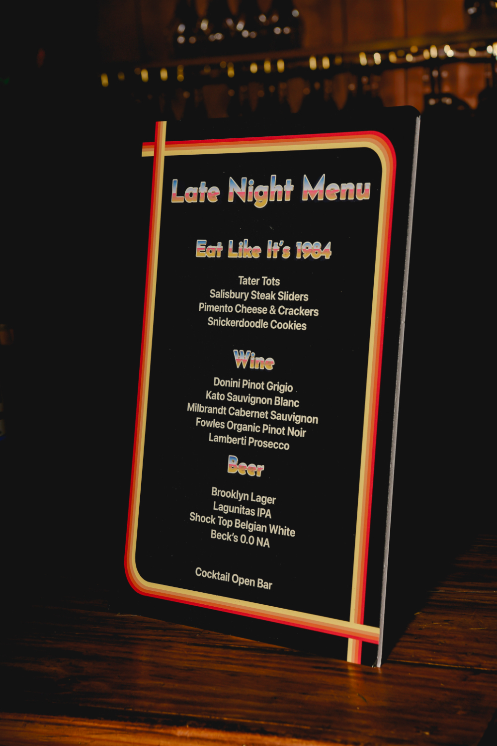 A retro-style sign listing the late-night menu offerings.