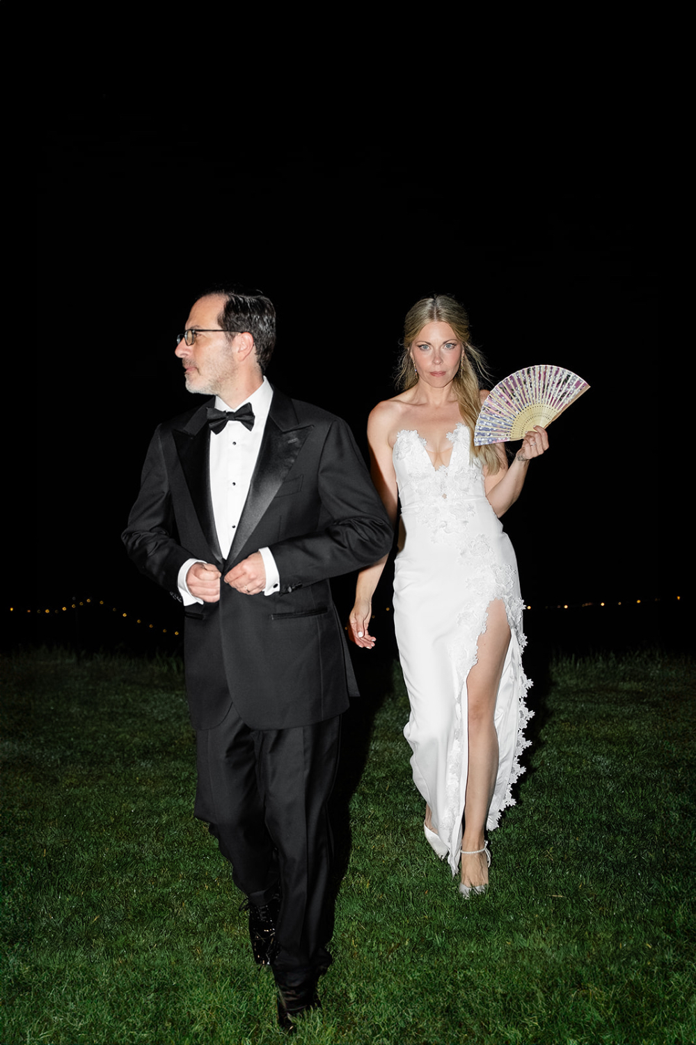 Bride and groom standing together outdoors during their wedding day