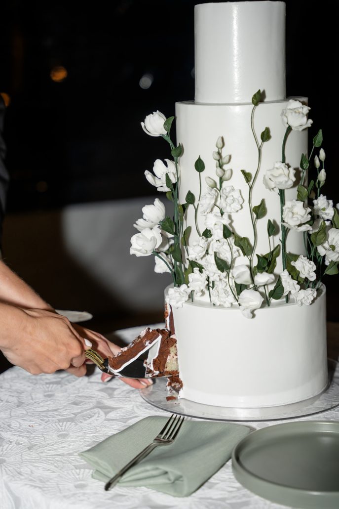Cutting the cake at a home wedding showing how to plan a home wedding timeline moments