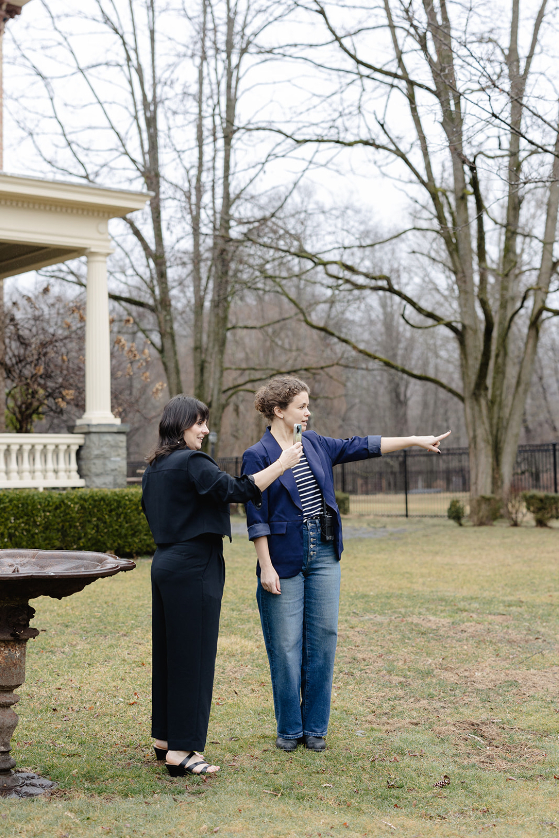 Full service wedding planner doing a walkthrough with a vendor on an outdoor wedding venue site.