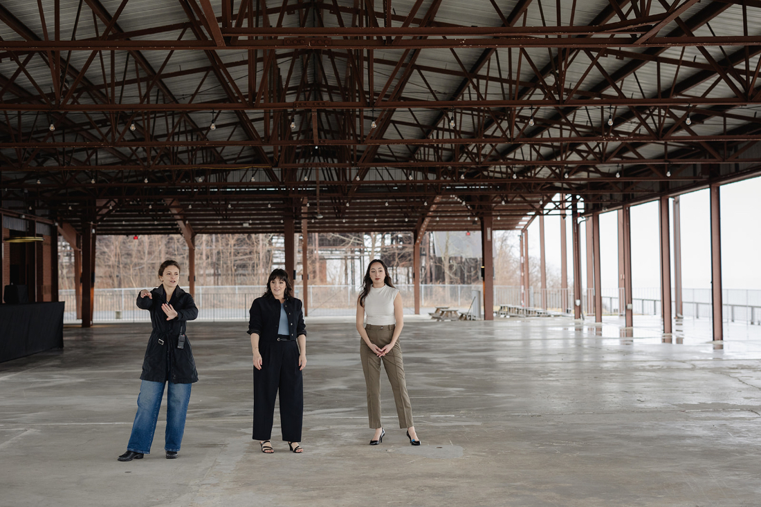Full service wedding planner team assessing an open-air wedding venue during the planning phase.