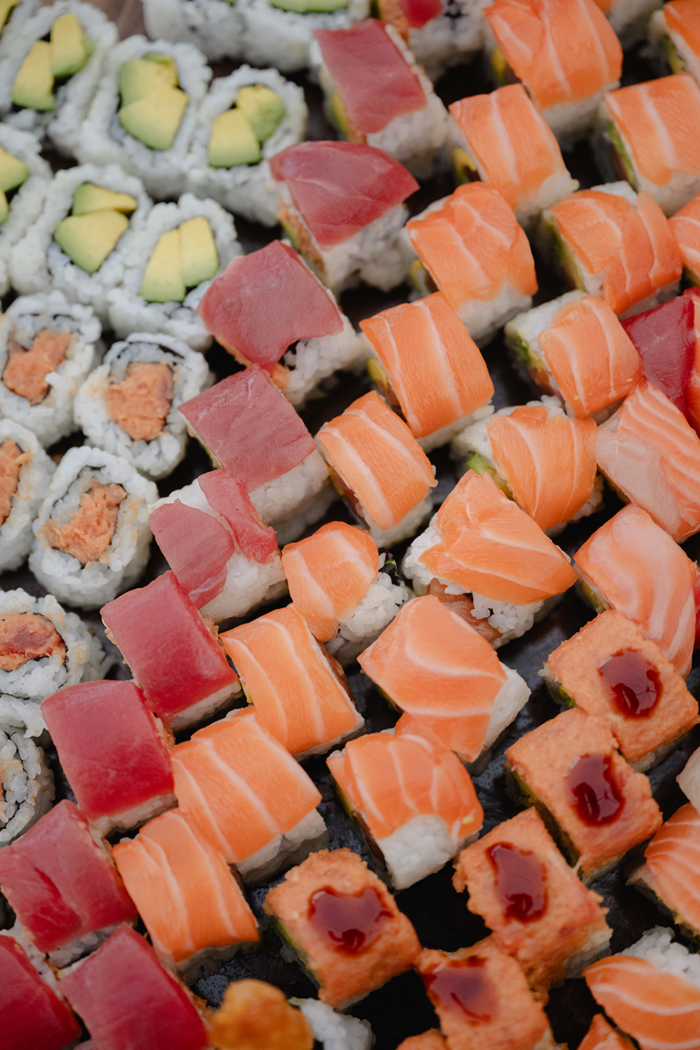 Assorted sushi display for wedding cocktail hour, illustrating how much does a luxury wedding cost through premium catering selections
