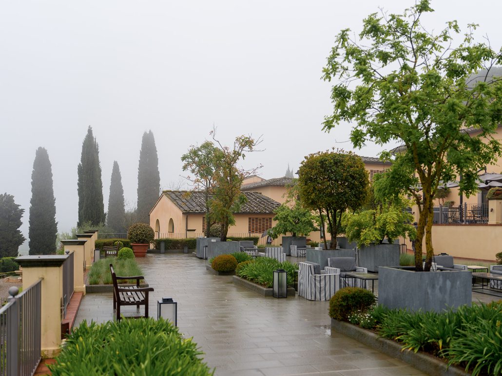Elegant terrace and gardens at a luxury destination wedding Italy estate in Tuscany.