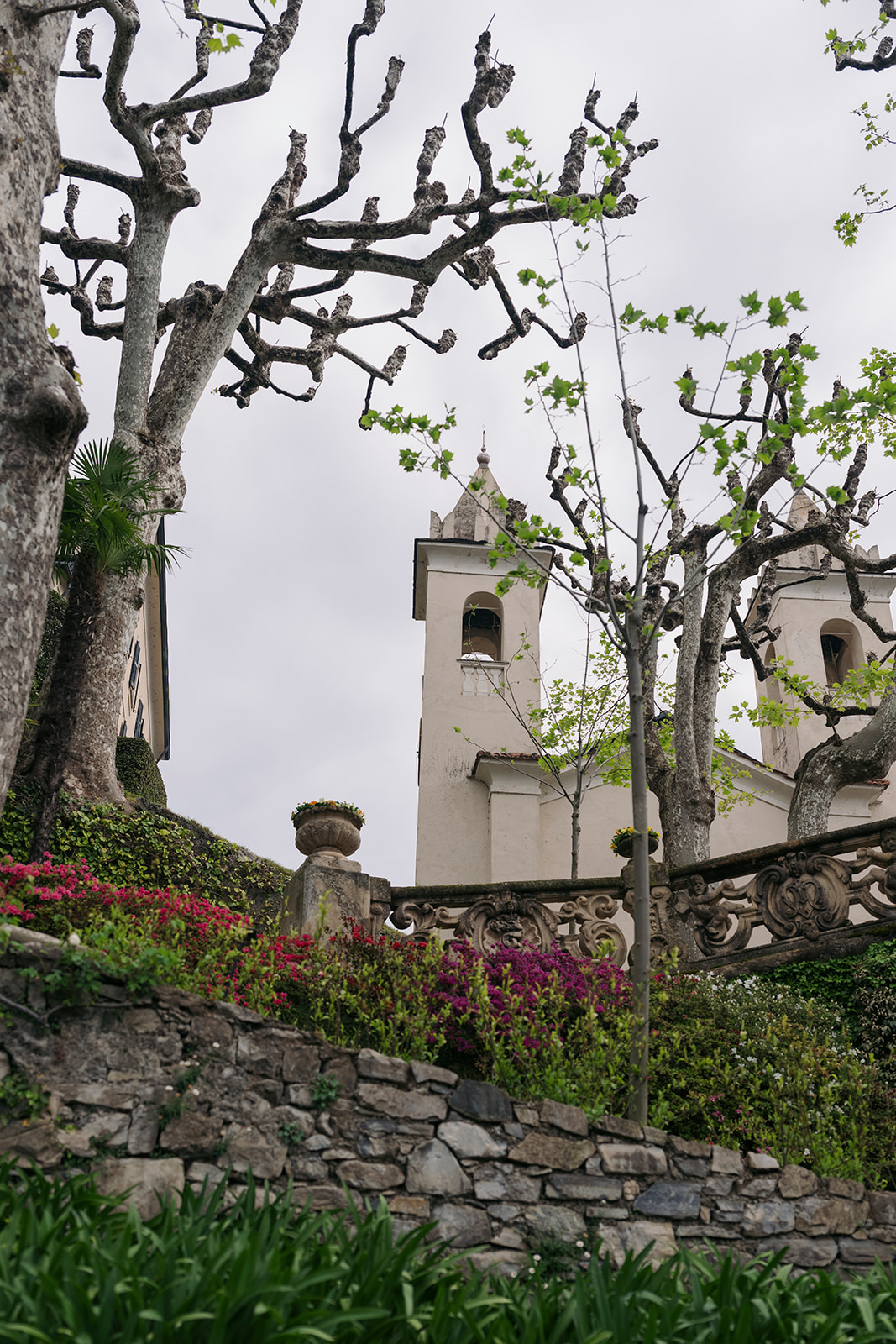 Historic church and terraced gardens at Villa Balbianello, a popular destination wedding Italy venue on Lake Como.