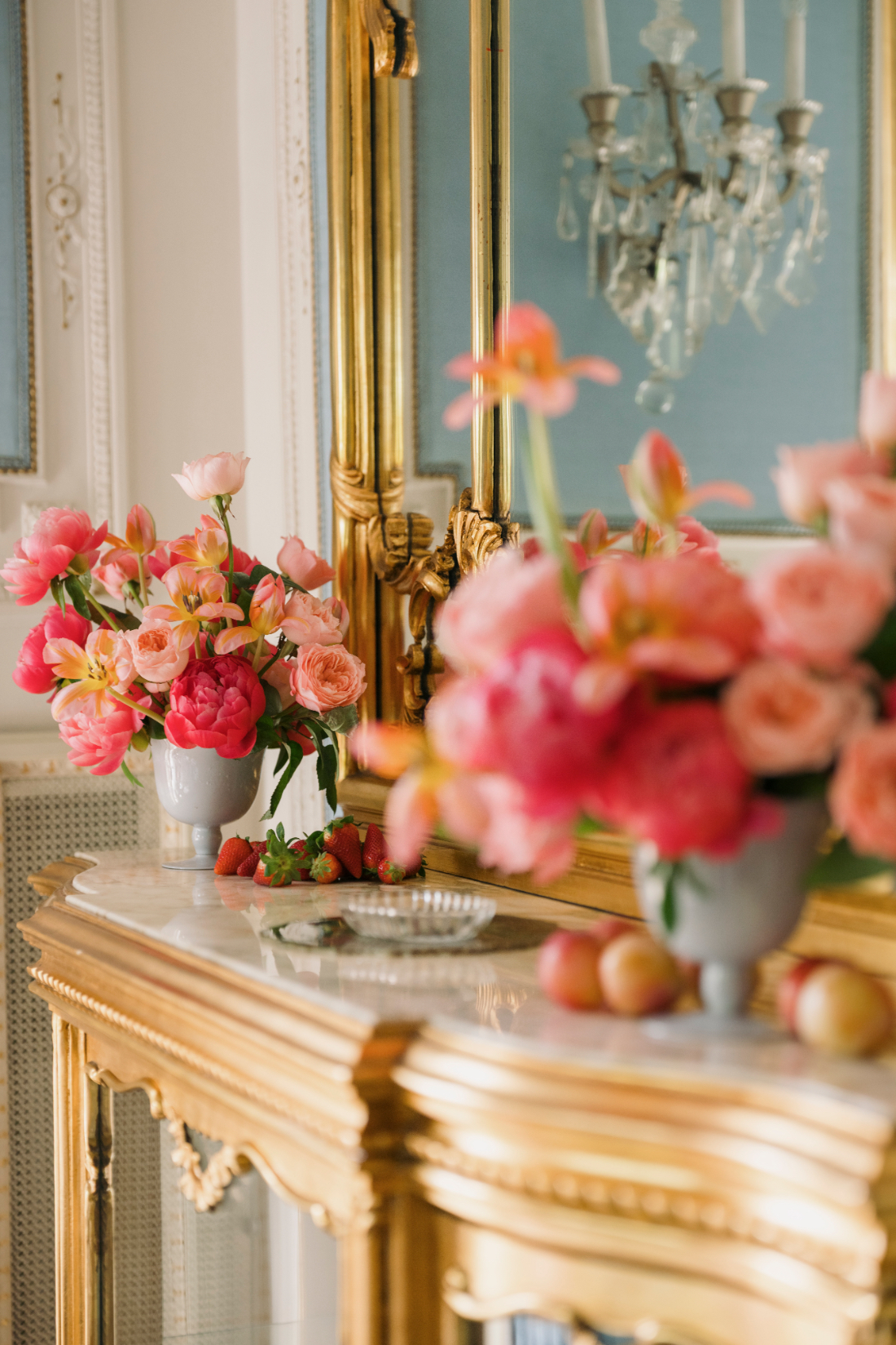 Luxury floral arrangements decorating the villa's grand fireplace