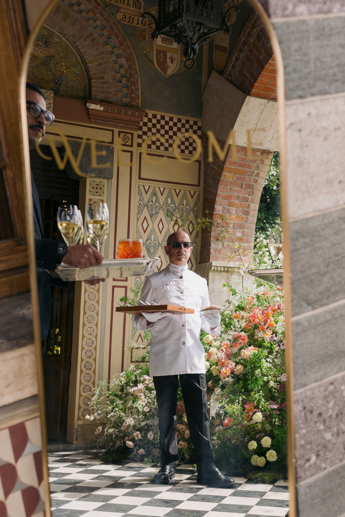 Elegant catering staff serving champagne and cocktails during a luxury wedding reception