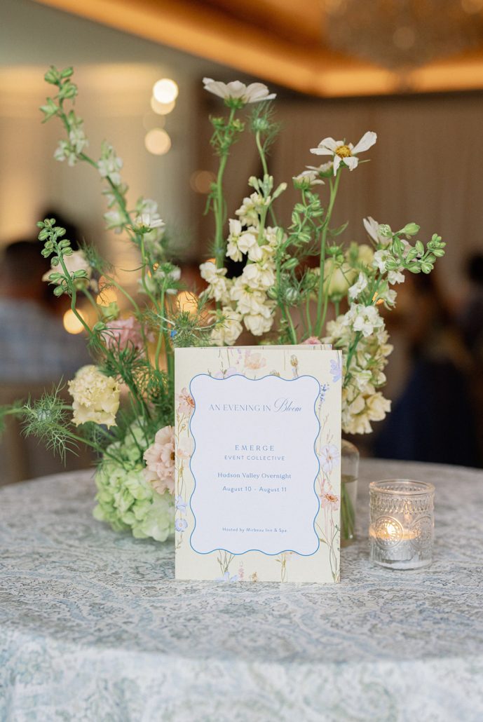 Floral stationery and garden-inspired centerpiece at Mirbeau Beacon, a Beacon NY wedding venue