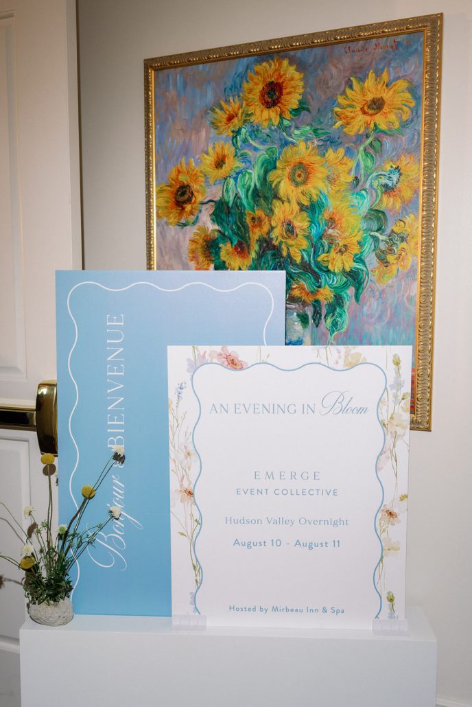 Monet-inspired event signage displayed alongside artwork at Mirbeau Beacon
