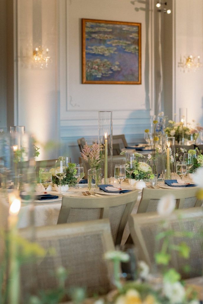 Candlelit reception tables inspired by Monet at a French-inspired Beacon NY wedding venue