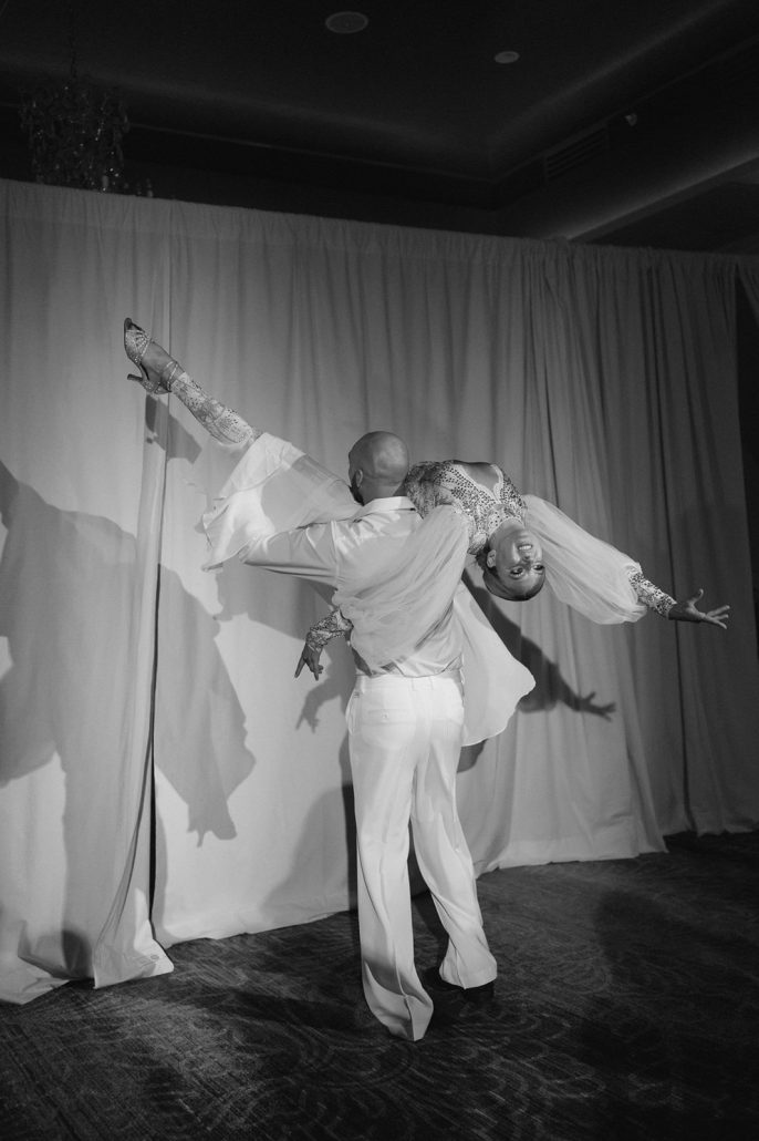 Luxury event planner creates an immersive dinner experience featuring a theatrical shadow dance performance for seated guests.